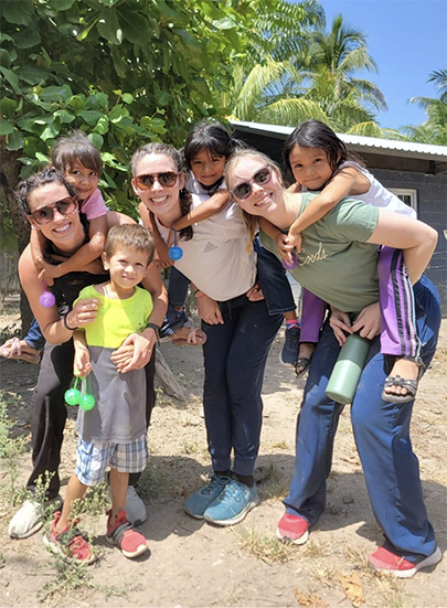 Volunteer medical students Interacting with the locals on mission trip
